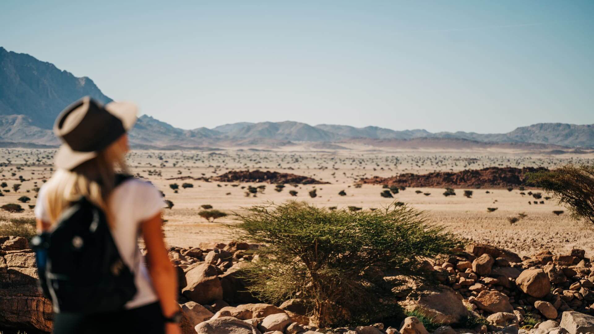 A tourist exploring the desert landscape